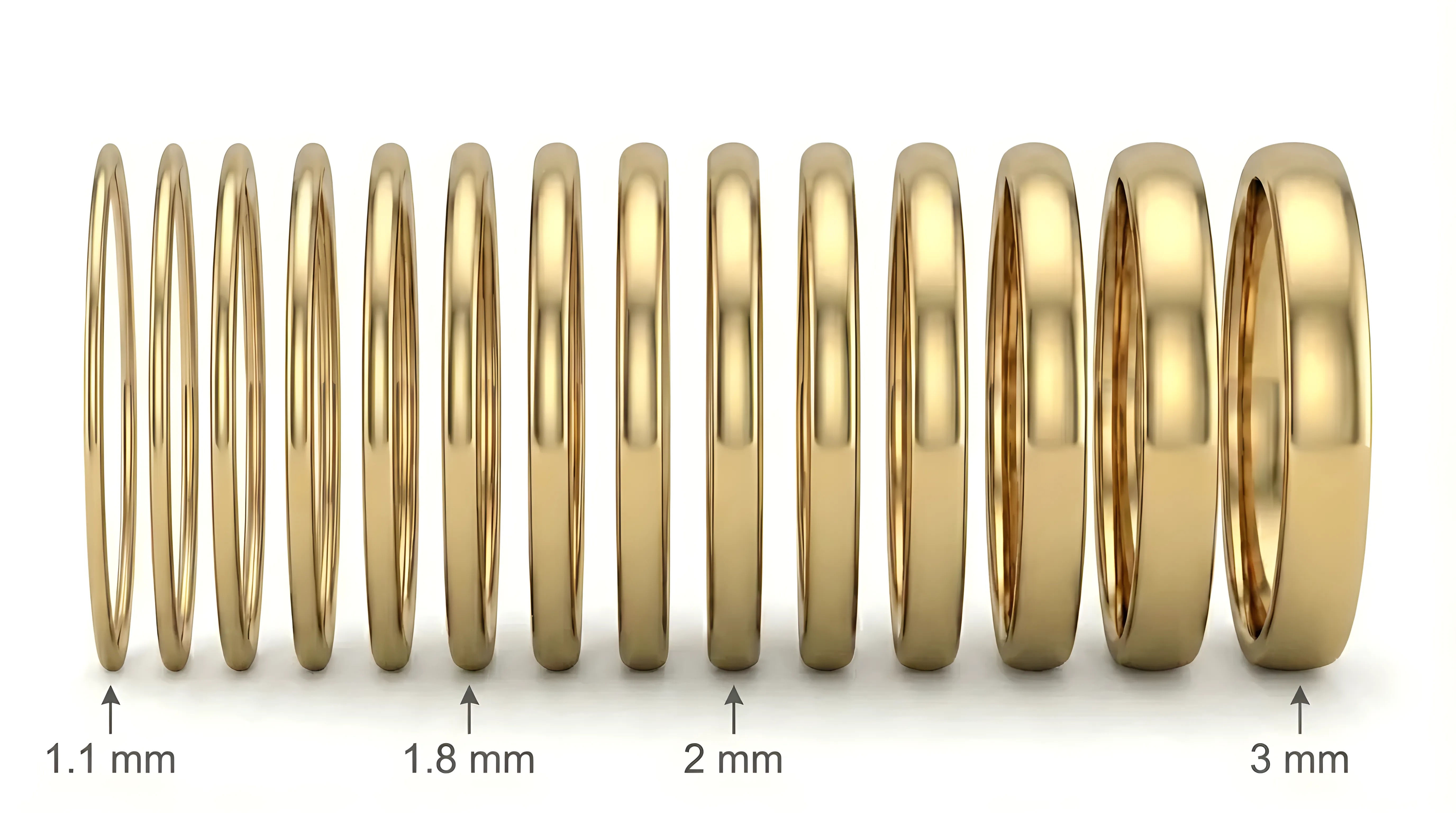 Engagement ring band width comparison showing 1.1mm, 1.8mm, 2mm and 3mm gold bands side by side